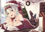  1girl bell black_legwear breasts brown_eyes christmas christmas_tree cleavage dress gloves hairband hat highres kantai_collection long_hair looking_at_viewer lying on_stomach open_mouth pantyhose red_dress santa_costume santa_hat senwa shoukaku_(kantai_collection) silver_hair smile solo sunlight 