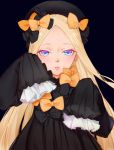  1girl abigail_williams_(fate/grand_order) bangs black_background black_bow black_dress black_hat blonde_hair blue_eyes bow commentary_request dress eyebrows_visible_through_hair fate/grand_order fate_(series) forehead hair_bow hands_up hat long_hair long_sleeves looking_at_viewer orange_bow parted_bangs parted_lips polka_dot polka_dot_bow sakyou_nashihana simple_background sleeves_past_fingers sleeves_past_wrists solo very_long_hair 