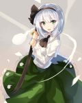  1girl black_neckwear black_ribbon commentary_request eyebrows_visible_through_hair green_eyes green_skirt highres hitodama holding holding_sword holding_weapon juliet_sleeves katana konpaku_youmu konpaku_youmu_(ghost) long_sleeves looking_at_viewer neck_ribbon open_mouth petticoat puffy_sleeves ribbon rin_falcon sheath sheathed shirt short_hair silver_hair skirt smile solo sword touhou weapon white_shirt 