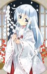  1girl blue_eyes cowboy_shot flower gohei hakama hibiki_(kantai_collection) highres hizuki_yayoi japanese_clothes kantai_collection long_hair miko red_hakama ribbon-trimmed_sleeves ribbon_trim silver_hair solo window 