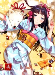  1girl animal blush commentary_request dog flower hair_flower hair_ornament hair_ribbon hanetsuki japanese_clothes kimono long_hair looking_at_viewer lying new_year obi on_back original ribbon sash smile tagme tan_(tangent) wide_sleeves year_of_the_dog yukata 