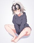  1girl ahoge bangs bare_legs barefoot between_legs blush breasts closed_mouth commentary_request eyebrows_visible_through_hair eyes_visible_through_hair fate/grand_order fate_(series) feet feet_together full_body grey_background grey_sweater hand_between_legs highres hood hood_down hooded_sweater jeanne_d&#039;arc_(alter)_(fate) jeanne_d&#039;arc_(fate)_(all) long_sleeves looking_at_viewer medium_breasts pout shadow short_hair silver_hair simple_background solo spicy_moo sweater yellow_eyes 