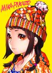  1girl artist_name bangs beanie braid brown_eyes brown_hair closed_mouth commentary_request earrings eyeshadow hat hood hood_down hoodie jewelry looking_at_viewer makeup mika_pikazo original portrait simple_background smile solo twin_braids upper_body yellow_background 