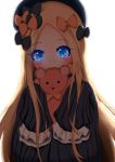  1girl abigail_williams_(fate/grand_order) bangs black_bow black_dress black_hat blonde_hair blue_eyes blush bow commentary_request covered_mouth dress eyebrows_visible_through_hair fate/grand_order fate_(series) forehead glowing glowing_eyes hair_bow hat highres holding holding_stuffed_animal long_sleeves looking_at_viewer orange_bow parted_bangs peru_(perushee) polka_dot polka_dot_bow simple_background sleeves_past_fingers sleeves_past_wrists solo stuffed_animal stuffed_toy teddy_bear white_background 