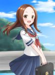  1girl :d bangs blue_skirt blurry blush brown_eyes brown_hair clouds day depth_of_field from_side guard_rail holding hoshino_kagari karakai_jouzu_no_takagi-san long_hair looking_at_viewer neckerchief open_mouth outdoors parted_bangs pleated_skirt school_briefcase school_uniform serafuku shirt short_sleeves skirt sky smile solo standing takagi-san v_arms white_shirt wind 