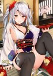  1girl azur_lane black_legwear breasts brown_eyes choker collarbone commentary_request cup highres indoors iron_cross large_breasts looking_at_viewer mole mole_on_breast multicolored_hair nail_polish prinz_eugen_(azur_lane) red_nails redhead sakazuki sideboob sitting smile solo streaked_hair syun_(05250) thigh-highs two_side_up 