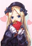  1girl abigail_williams_(fate/grand_order) absurdres bangs black_bow black_dress black_hat blonde_hair blue_eyes bow commentary_request covered_mouth dress fate/grand_order fate_(series) gift hair_bow hat head_tilt heart highres holding holding_gift long_hair long_sleeves looking_at_viewer orange_bow parted_bangs sleeves_past_fingers sleeves_past_wrists solo striped valentine vertical-striped_background vertical_stripes very_long_hair yuuki_nao_(pixiv10696483) 