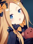  1girl :o abigail_williams_(fate/grand_order) bangs black_bow black_dress blonde_hair blue_background blue_eyes blush bow commentary_request dress fate/grand_order fate_(series) forehead hair_bow head_tilt highres long_hair long_sleeves looking_at_viewer object_hug open_mouth orange_bow parted_bangs polka_dot polka_dot_bow sada_(sadahalu) simple_background sleeves_past_fingers sleeves_past_wrists solo stuffed_animal stuffed_toy teddy_bear very_long_hair 