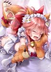  1girl animal_ears bangs bell bell_collar bent_knees blush bonnet bow breasts cat cat_day cat_hair_ornament cat_paws claws cleavage closed_eyes collar commentary_request dress eyebrows_visible_through_hair fangs fate/grand_order fate_(series) fox_ears fox_tail gloves hair_between_eyes hair_ornament hair_ribbon hane_yuki highres jingle_bell large_breasts long_hair looking_at_viewer lying on_stomach open_mouth paw_gloves paw_shoes paws pink_hair pointing ponytail purple_dress red_bow red_collar red_ribbon redhead ribbon shoes short_sleeves simple_background solo tail tamamo_(fate)_(all) tamamo_cat_(fate) 