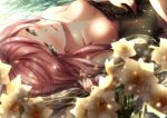  1girl breasts cleavage day dies_irae flower green_eyes hand_on_own_stomach highres long_hair looking_at_viewer lying medium_breasts mia_(gute-nacht-07) on_back outdoors parted_lips pink_hair rusalka_schwagerin solo white_flower 