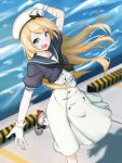  1girl blonde_hair blue_eyes blue_sailor_collar commentary_request dress feet_out_of_frame gloves hat highres holding holding_hat jervis_(kantai_collection) kantai_collection long_hair looking_at_viewer mary_janes open_mouth pier sailor_collar sailor_dress sailor_hat shingyo shoes short_sleeves smile solo standing standing_on_one_leg water white_dress white_gloves white_hat 
