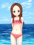  1girl aposine arms_behind_back bikini blue_sky blush brown_eyes brown_hair closed_mouth clouds collarbone cowboy_shot day frilled_bikini frilled_bikini_top frills highres horizon karakai_jouzu_no_takagi-san long_hair looking_at_viewer navel ocean outdoors pink_bikini side-tie_bikini sky smile solo standing stomach swimsuit takagi-san water 