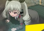  1girl anchovy anzio_military_uniform arm_support bangs belt black_belt black_neckwear blurry blurry_background blurry_foreground carro_armato_p40 commentary day depth_of_field dress_shirt drill_hair excel_(shena) girls_und_panzer green_hair grey_jacket grey_pants ground_vehicle highres jacket leaning_forward long_hair military military_uniform military_vehicle motor_vehicle necktie open_mouth outdoors pants red_eyes sam_browne_belt shirt solo sweatdrop tank twin_drills twintails uniform v-shaped_eyebrows white_shirt 