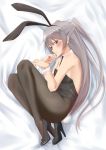  1girl absurdres amatsukaze_(kantai_collection) animal_ears bed black_leotard black_neckwear brown_eyes bunny_tail bunnysuit commentary_request detached_collar fetal_position flat_chest from_above highres joji kantai_collection leotard long_hair looking_at_viewer lying necktie on_side pantyhose rabbit_ears silver_hair solo strapless strapless_leotard tail two_side_up wrist_cuffs 