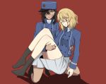  2girls bangs bc_freedom_(emblem) bc_freedom_military_uniform black_footwear black_hair black_legwear blonde_hair blood blood_on_face bloody_clothes blue_hat blue_jacket blue_vest boots brown_eyes carrying closed_eyes commentary_request constricted_pupils dark_skin dress_shirt emblem full_body girls_und_panzer hat high_collar jacket knee_boots kneeling long_sleeves looking_at_viewer marie_(girls_und_panzer) medium_hair military military_hat military_uniform miniskirt multiple_girls oshida_(girls_und_panzer) pleated_skirt princess_carry red_background scatter shadow shako_cap shirt simple_background skirt socks uniform vest white_shirt white_skirt 