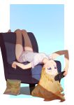  1girl 3four barefoot blonde_hair blue_eyes chair chips eating food gabriel_dropout handheld_game_console long_hair lying playstation_portable potato_chips shirt short_sleeves simple_background solo t-shirt tenma_gabriel_white upside-down white_shirt 