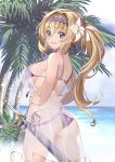  1girl absurdres ass bangs bare_arms bare_shoulders bikini blonde_hair blue_eyes blush breasts bush cowboy_shot day eyebrows_visible_through_hair flower front-tie_bikini front-tie_top granblue_fantasy hair_flower hair_intakes hair_ornament hairband hands_on_hips highres horizon jeanne_d&#039;arc_(granblue_fantasy) kaorihero large_breasts long_hair looking_at_viewer nail_polish ocean outdoors palm_tree purple_bikini purple_hairband purple_nails purple_ribbon ribbon see-through sheath sheathed shiny shiny_hair shiny_skin side-tie_bikini sideboob solo standing strap_gap swimsuit tareme tree very_long_hair water white_ribbon 