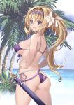  1girl absurdres ass bangs bare_arms bare_shoulders bikini blonde_hair blue_eyes blush breasts bush cowboy_shot day eyebrows_visible_through_hair flower front-tie_bikini front-tie_top granblue_fantasy hair_flower hair_intakes hair_ornament hairband hands_on_hips highres horizon jeanne_d&#039;arc_(granblue_fantasy) kaorihero large_breasts long_hair looking_at_viewer nail_polish ocean outdoors palm_tree purple_bikini purple_hairband purple_nails purple_ribbon ribbon sheath sheathed shiny shiny_hair shiny_skin side-tie_bikini sideboob solo standing strap_gap swimsuit tareme tree very_long_hair water white_ribbon 