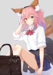  1girl animal_ears blush breasts clothes_around_waist fate/extella fate/extra fate/grand_order fate_(series) fox_ears fox_tail highres jacket_around_waist kazuha_(saku_kn) large_breasts long_hair looking_at_viewer pink_hair school_uniform shirt sitting skirt smile solo tail tamamo_(fate)_(all) tamamo_jk_(fate) thighs twintails yellow_eyes 