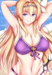  1girl absurdres armpits arms_behind_head arms_up bangs bare_shoulders beach bikini blonde_hair breasts cleavage collarbone diadem eyebrows_visible_through_hair flower granblue_fantasy hair_between_eyes hair_flower hair_intakes hair_ornament highres jeanne_d&#039;arc_(granblue_fantasy) large_breasts lily_(flower) long_hair navel outdoors pixcel purple_bikini smile solo swimsuit sword waist weapon white_flower 