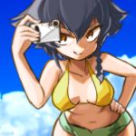  1girl bangs bikini bikini_shorts black_hair blurry blurry_background blurry_foreground braid breasts brown_eyes camera clouds cloudy_sky commentary_request cowboy_shot day depth_of_field eisu_(eith) girls_und_panzer green_bikini_bottom grin hand_on_hip holding looking_at_viewer medium_breasts mismatched_bikini navel outdoors pepperoni_(girls_und_panzer) short_hair shorts side_braid sky smile solo standing swimsuit twitter_username v-shaped_eyebrows yellow_bikini_top 