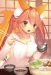  1girl animal_ears blush bowl breasts cleavage collarbone eyebrows_visible_through_hair fang fate/grand_order fate_(series) food food_request fox_ears fox_tail indoors large_breasts long_hair long_sleeves looking_at_viewer mogullaz open_mouth pink_hair pot smile solo standing tail tamamo_(fate)_(all) tamamo_no_mae_(fate) thick_eyebrows twintails yellow_eyes 