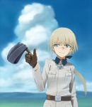  1girl belt blonde_hair blue_eyes blue_sky brown_gloves cowboy_shot facial_scar gloves hanna_rudel hat hat_removed headwear_removed iron_claw leather leather_gloves long_hair ponytail scar shiratama_(hockey) sky smile solo strike_witches uniform white_cloak world_witches_series 