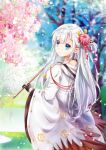  1girl azur_lane bangs bare_tree black_gloves blue_eyes blue_sky blunt_bangs blurry blurry_background cherry_blossoms closed_mouth eyebrows_visible_through_hair flower from_behind gloves hair_flower hair_ornament hair_over_shoulder highres holding hood hood_down japanese_clothes kimono long_hair looking_at_viewer looking_back mutang nape open_mouth outdoors partly_fingerless_gloves petals pond shoukaku_(azur_lane) sidelocks silver_hair sky smile solo tassel tree wide_sleeves wind 