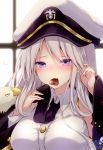  1girl animal azur_lane badge bald_eagle bangs bird black_coat black_neckwear blurry blurry_background blush breasts buttons chocolate chocolate_heart collared_shirt eagle enterprise_(azur_lane) eyebrows_visible_through_hair hat heart holding kabocha_usagi large_breasts long_hair long_sleeves looking_at_viewer military military_hat military_uniform mouth_hold necktie nose_blush off_shoulder shirt sidelocks signature silver_hair sleeveless sleeveless_shirt solo uniform upper_body valentine violet_eyes white_shirt window wing_collar 