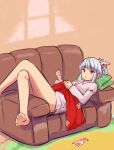  1girl alternate_hairstyle barefoot blue_hair bottomless bow buttons collared_shirt couch fujiwara_no_mokou hair_bow highres legs_crossed lying miyo_(ranthath) needle on_back pants pants_removed ponytail red_eyes red_pants sewing sewing_needle shirt sidelocks solo touhou white_shirt 