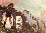  1boy bangs bicycle black_eyes black_hair blue_sky blunt_bangs bridge cherry_blossoms child clouds gakuran glasses ground_vehicle hat leaning_against_railing male_focus noeyebrow_(mauve) original outdoors petals power_lines railing school_uniform short_hair shorts sky spring_(season) 