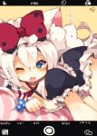  1girl ;o american_flag american_flag_print animal_ears azur_lane bangs black_dress blue_eyes blush bow cat_ears commentary_request dress eyebrows_visible_through_hair flag_print hair_between_eyes hair_bow hammann_(azur_lane) highres long_hair looking_at_viewer lying muuran on_stomach one_eye_closed outstretched_arm phone_screen print_neckwear puffy_short_sleeves puffy_sleeves red_bow short_sleeves signature silver_hair solo translated upper_teeth very_long_hair 