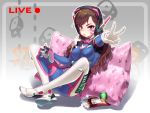  1girl animal_print bodysuit breasts brown_eyes brown_hair bunny_print can chips commentary controller d.va_(overwatch) dualshock facial_mark food game_controller gamepad gloves headphones long_hair looking_at_viewer medium_breasts mouth_hold overwatch pillow pink_pillow print_pillow sitting solo v white_gloves winddale 