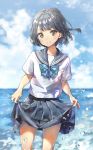  1girl bangs black_hair blue_bow blue_skirt blue_sky bow bowtie brown_eyes clouds cowboy_shot day highres looking_at_viewer miniskirt ocean original outdoors pleated_skirt shiny shiny_hair shirt short_hair short_sleeves skirt skirt_hold sky smile solo standing takenoko_no_you wading white_shirt 