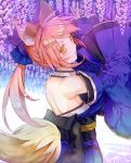  1girl animal_ears backless_outfit blue_bow blue_kimono bow detached_sleeves eyebrows_visible_through_hair fate/grand_order fate_(series) flower fox_ears fox_tail hair_bow head_tilt highres japanese_clothes kimono long_hair looking_at_viewer looking_back pink_hair ponytail purple_bow purple_flower saijou_haruki smile solo standing tail tamamo_(fate)_(all) tamamo_no_mae_(fate) wisteria yellow_eyes 