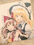  2girls :d :o ascot bare_shoulders black_hat black_neckwear black_ribbon black_vest blonde_hair bow brown_hair commentary_request detached_sleeves eyebrows_visible_through_hair frilled_hat frills hair_bow hair_tubes hakurei_reimu hand_on_another&#039;s_shoulder hand_on_headwear hat hat_bow highres japanese_clothes kirisame_marisa looking_at_viewer multiple_girls neck_ribbon open_mouth photo puffy_short_sleeves puffy_sleeves red_bow red_vest ribbon round_teeth short_sleeves smile teeth touhou vanilla_(miotanntann) vest white_bow yellow_eyes yellow_neckwear 