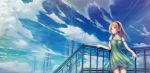  1girl black_hairband blonde_hair blue_shirt blue_sky clouds collarbone cowboy_shot dress floating_hair green_dress hairband highres long_hair original pinafore_dress red_eyes scenery shirt short_dress short_sleeves sky sleeveless sleeveless_dress smile solo standing tenmaso 