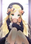  1girl abigail_williams_(fate/grand_order) anzu_yoshihiro bangs black_bow black_dress black_hat blonde_hair bloomers blurry blurry_background blush bow bug butterfly commentary_request covered_mouth depth_of_field dress eyebrows_visible_through_hair fate/grand_order fate_(series) forehead green_eyes hair_bow hat head_tilt highres insect long_hair long_sleeves object_hug orange_bow parted_bangs sleeves_past_fingers sleeves_past_wrists solo stuffed_animal stuffed_toy tears teddy_bear underwear very_long_hair white_bloomers 