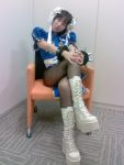  boots chun-li cosplay crossed_legs double_buns pantyhose photo sitting street_fighter 