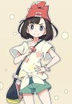  1girl bag beanie black_hair blue_eyes eyebrows_visible_through_hair floral_print green_shorts hand_on_hip handbag hat holding holding_poke_ball ixy mizuki_(pokemon_sm) poke_ball pokemon pokemon_(game) pokemon_sm red_hat shirt short_hair short_sleeves shorts simple_background smile solo tied_shirt z-ring 