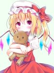  1girl blonde_hair blush closed_mouth commentary_request esureki eyebrows_visible_through_hair flandre_scarlet hat highres holding holding_stuffed_animal long_hair looking_at_viewer red_eyes red_ribbon red_skirt ribbon short_sleeves side_ponytail skirt solo stuffed_animal stuffed_toy teddy_bear touhou wings 