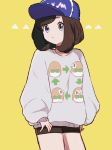  1girl alternate_costume baseball_cap black_hair black_shorts blue_hat gen_7_pokemon hat highres kn_9620 long_sleeves mizuki_(pokemon_sm) pokemon pokemon_(game) pokemon_sm rowlet short_hair shorts simple_background solo sweater yellow_background 