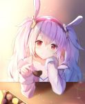  1girl animal_ears azur_lane bangs blurry_foreground blush breasts chocolate cleavage collarbone elbow_rest eyebrows_visible_through_hair hair_between_eyes hair_ornament hairband head_on_hand head_tilt heart-shaped_food highres jacket laffey_(azur_lane) light_particles long_hair long_sleeves looking_at_viewer mobu_(wddtfy61) offering_food rabbit_ears red_eyes red_hairband sidelocks silver_hair small_breasts smile solo twintails very_long_hair 