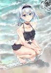  1girl beach bikini bikini_skirt black_bikini blue_eyes frilled_bikini frills hair_intakes hair_ornament highres light_blue_hair looking_at_viewer outdoors rock ryuuou_no_oshigoto! sand sayuuiede short_hair snowflake_hair_ornament solo sora_ginko squatting swimsuit wet 