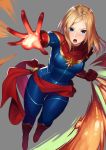  1girl blonde_hair blue_eyes bodysuit boots breasts captain_marvel clenched_hand gloves highres kagematsuri long_hair marvel open_mouth red_footwear red_gloves sash simple_background solo superhero 