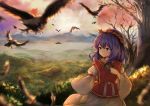  1girl bird blurry_foreground cherry_blossoms commentary_request cowboy_shot crow eyebrows_visible_through_hair hair_ornament hand_on_own_chest highres juliet_sleeves kushidama_minaka leaf_hair_ornament long_sleeves mountain outdoors puffy_sleeves purple_hair red_vest rope scenery short_hair sky solo standing sunset touhou tree vest violet_eyes wide_sleeves yasaka_kanako younger 