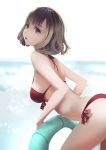  1girl bangs bikini breasts brown_hair day from_side grey_eyes innertube leaning_forward lips medium_breasts ocean original red_bikini short_hair side-tie_bikini soft_focus solo strap_gap swimsuit vafar7 