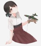  1girl a5m aircraft airplane bangs black_hair blue_ribbon brown_eyes folded_ponytail gloves hair_ribbon hakama hakama_skirt head_tilt highres japanese_clothes kanae_(inorin05kanae) kantai_collection kasuga_maru_(kantai_collection) long_hair looking_at_viewer red_hakama ribbon short_sleeves simple_background single_glove sitting solo swept_bangs white_background 