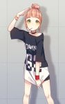  1girl bangs bike_shorts black_choker black_shirt blunt_bangs bracelet choker clothes_writing commentary_request drop_shadow earrings hair_bun hand_up ichiren_namiro jewelry legs_apart looking_at_viewer original pulled_by_self shirt shirt_pull solo star star_earrings v wristband 