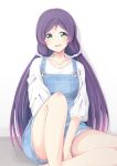  1girl :d between_legs blush casual chiro_(bocchiropafe) collarbone green_eyes hand_between_legs highres knee_up long_hair long_sleeves looking_at_viewer love_live! love_live!_school_idol_project open_mouth overall_shorts overalls purple_hair purple_scrunchie scrunchie shirt sitting smile solo toujou_nozomi twintails white_background white_shirt 